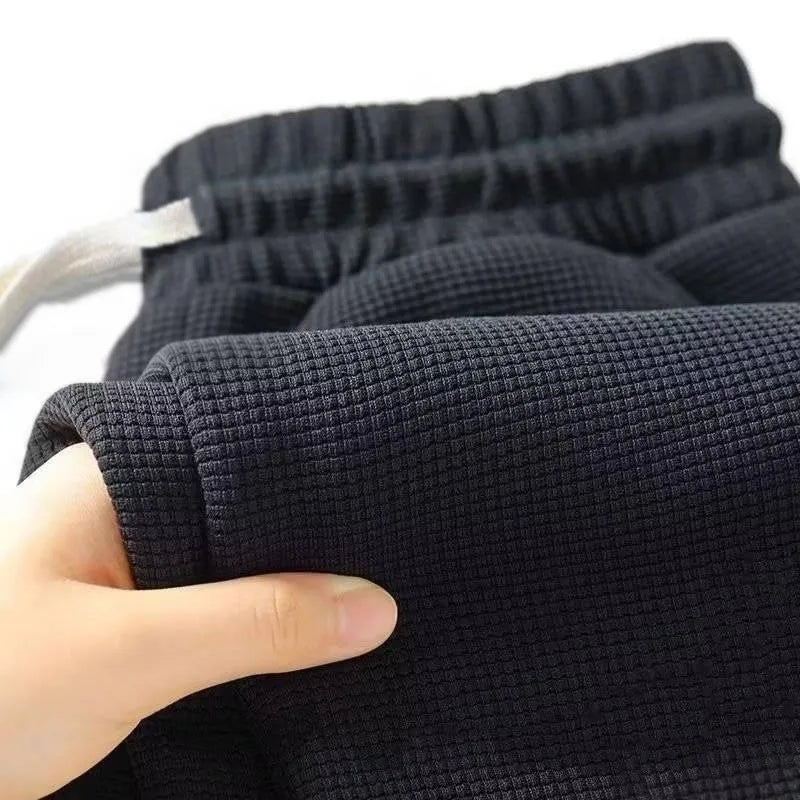 Men's retro knitted Waffle sweatpants, loose straight leg solid color pants with elastic waist and drawstring, suitable for autu.