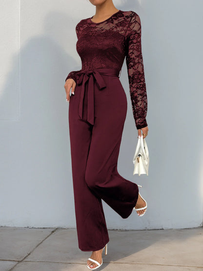 Woman Black Lace Sleeve Jumpsuit Round Neck Belted Waist Ideal for Evening Parties and Cocktail Events.