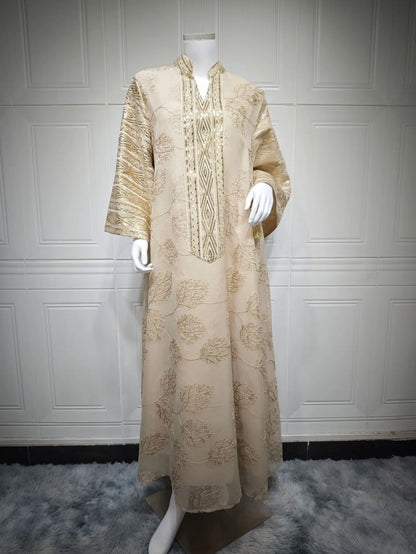 Muslim Women's Light Blue Islamic Embroidered Abaya with Gold Detailing Ideal for Formal Events in Middle East like UAE Saudi.