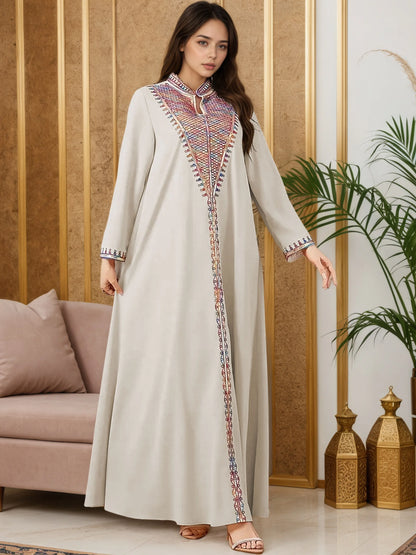 Trendy Muslim Abaya in Deep Blue Adorned with Intricate Multicolored Embroidery for Arabian Social Galas Modest Islam Fashion.