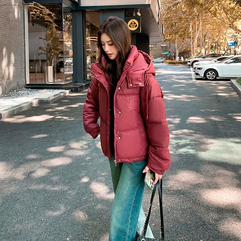 2024 Winter Neue frauen Unten Baumwolle Gefütterte Jacken Stilvolle Mit Kapuze Einfarbig Casual Verdicken Warme Lose anliegende kurze Mäntel