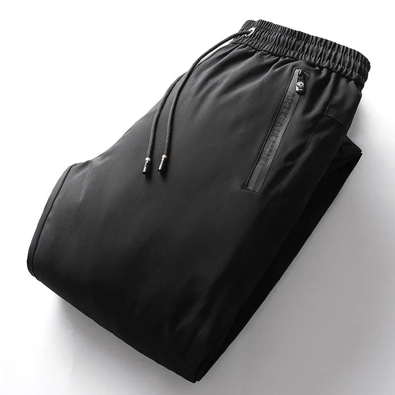 Men's Down Pants Autumn Winter New Solid Color Thickened Warm Outdoor Travel Adventure Harem Pants Men's Plus Size Casual Pants.