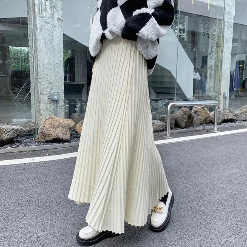 Knitted midi skirt women's A-line skirt high waist wide span mid length skirt.