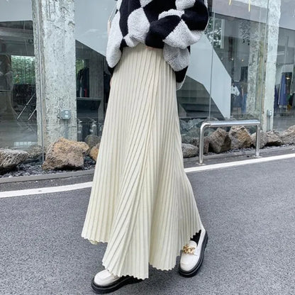 Knitted midi skirt women's A-line skirt high waist wide span mid length skirt.