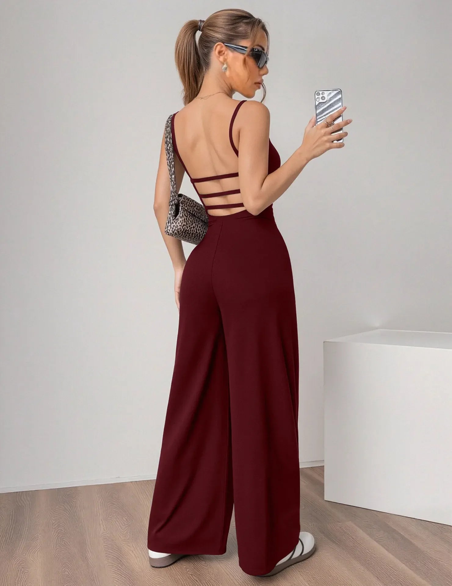 Fashionable Solid Color High Waist Bell Bottom Jumpsuit Backless Strap Casual Women's Long Pants One Piece Suit Female.