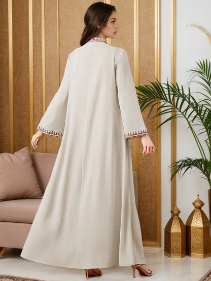 2025 New Luxury Muslim Abaya Off White Intricate Colorful Embroidery Detailing Ideal for Saudi Arabian Formal Gatherings Islam.