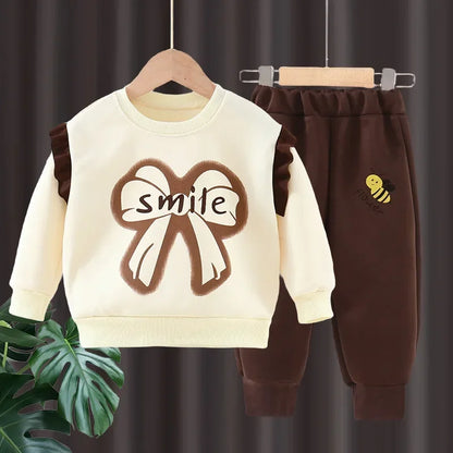 New 2025 Girls Fashion Cartoon Bowknot Letter Long Sleeve Pullover Sweatshirt + Pants Kids Spring Casual Sports Clothing Sets.