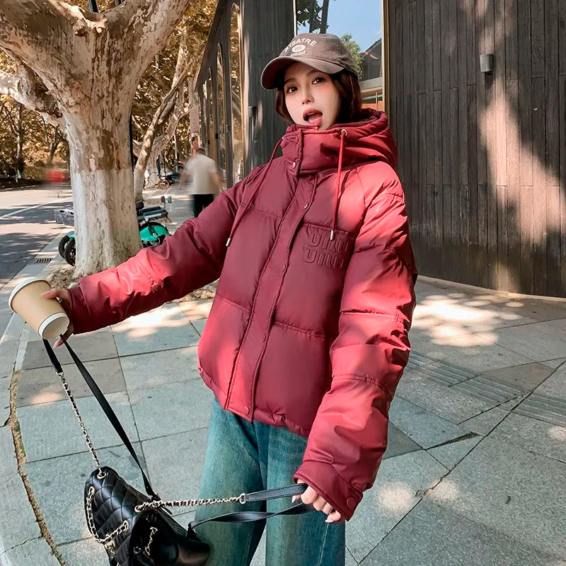 2024 Winter Neue frauen Unten Baumwolle Gefütterte Jacken Stilvolle Mit Kapuze Einfarbig Casual Verdicken Warme Lose anliegende kurze Mäntel