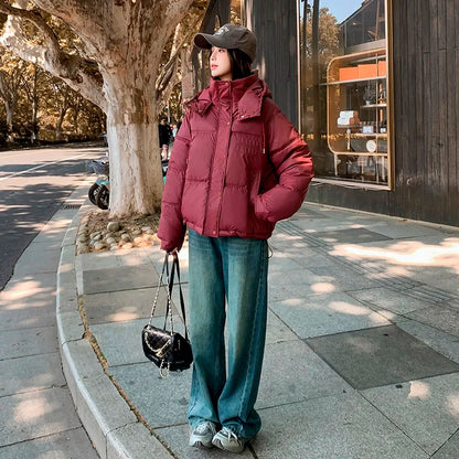 2024 Winter Neue frauen Unten Baumwolle Gefütterte Jacken Stilvolle Mit Kapuze Einfarbig Casual Verdicken Warme Lose anliegende kurze Mäntel
