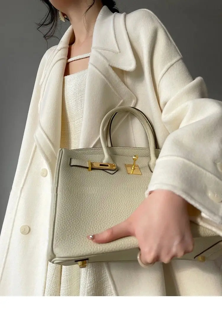 Weißer Mantel im französischen Stil, High-End-Temperament, Herbst-Winter, langer Wollmantel, 2025, neuer Damen-Wollmantel, modische lose Oberbekleidung.