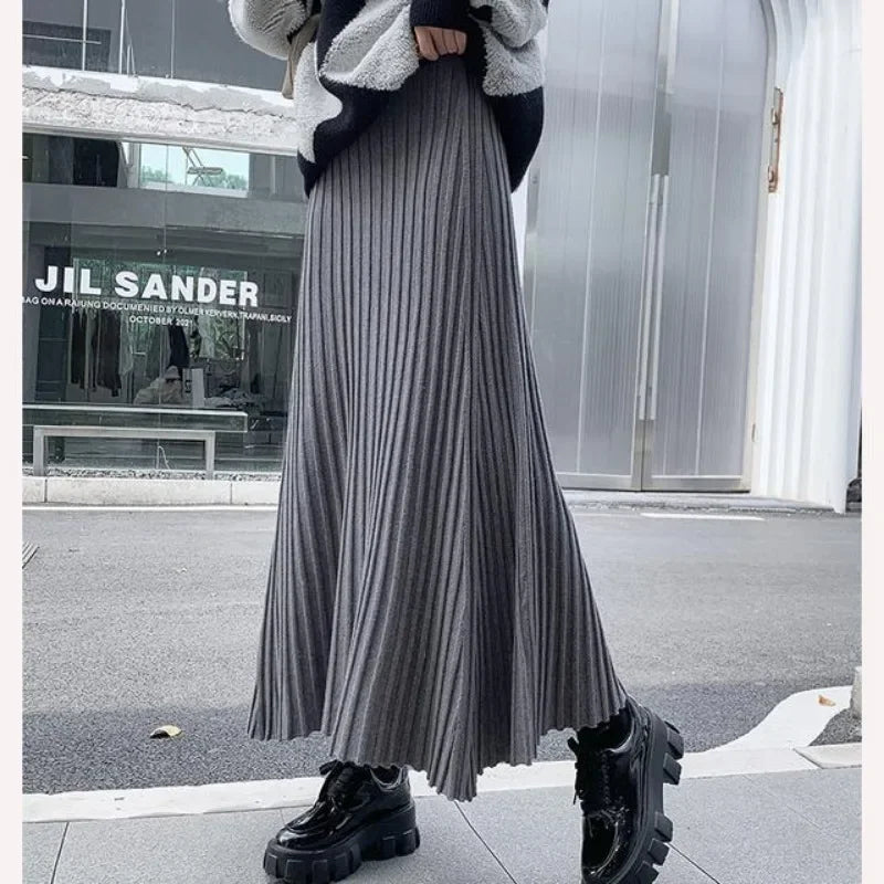 Knitted midi skirt women's A-line skirt high waist wide span mid length skirt.