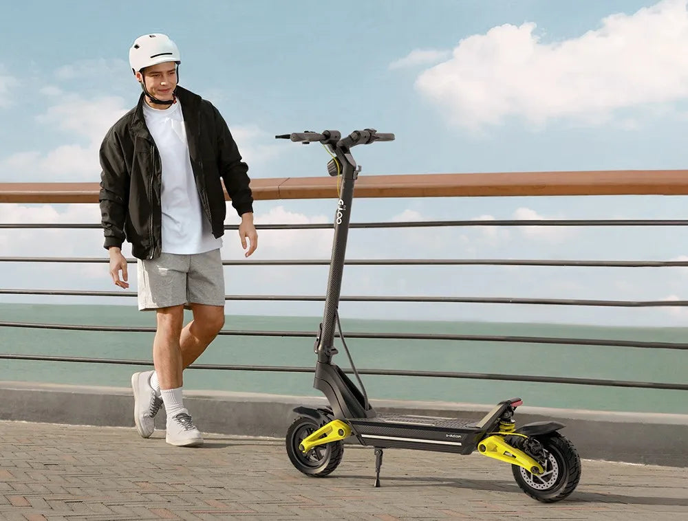 OOTD S10 Folding Electric Scooter 10 Inch Tires 1400W Motor 25km/h Max Speed 48V 20Ah Battery for 60-70km Range 120KG Max Load.